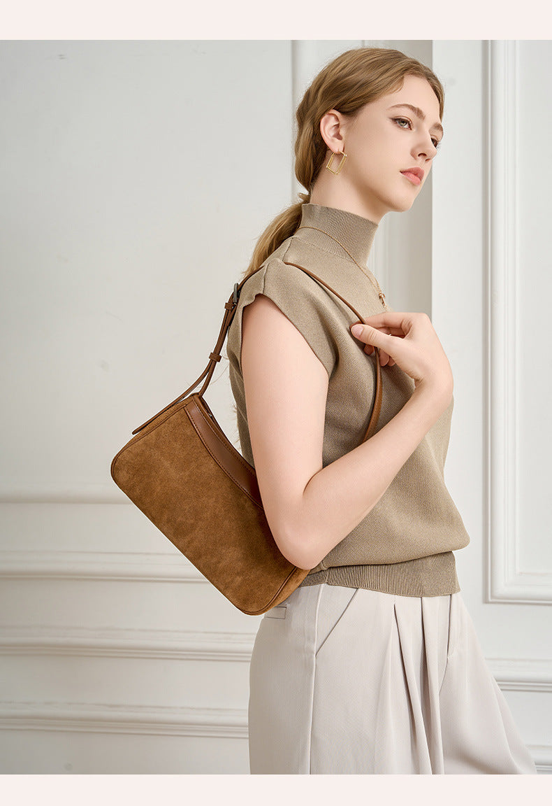 Close-up view of the bag's suede-textured exterior