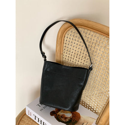Black cowhide bucket bag with single shoulder strap