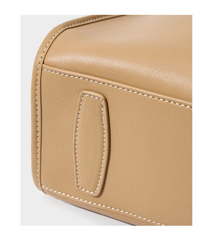 Close-up of apricot leather stitching and base detail