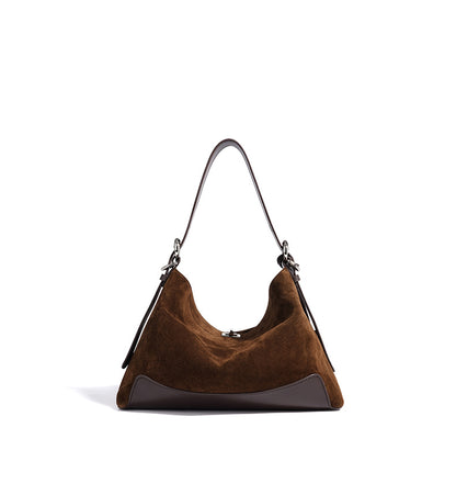 Side view showing the tote's depth and strap attachment