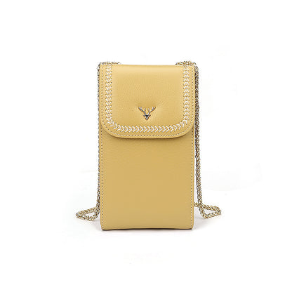 Banana yellow cowhide mini crossbody phone bag with gold tone chain strap and magnetic snap flap
