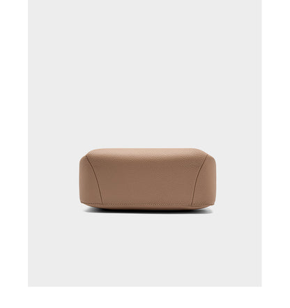 Bottom view of pebbled leather bag showing base construction