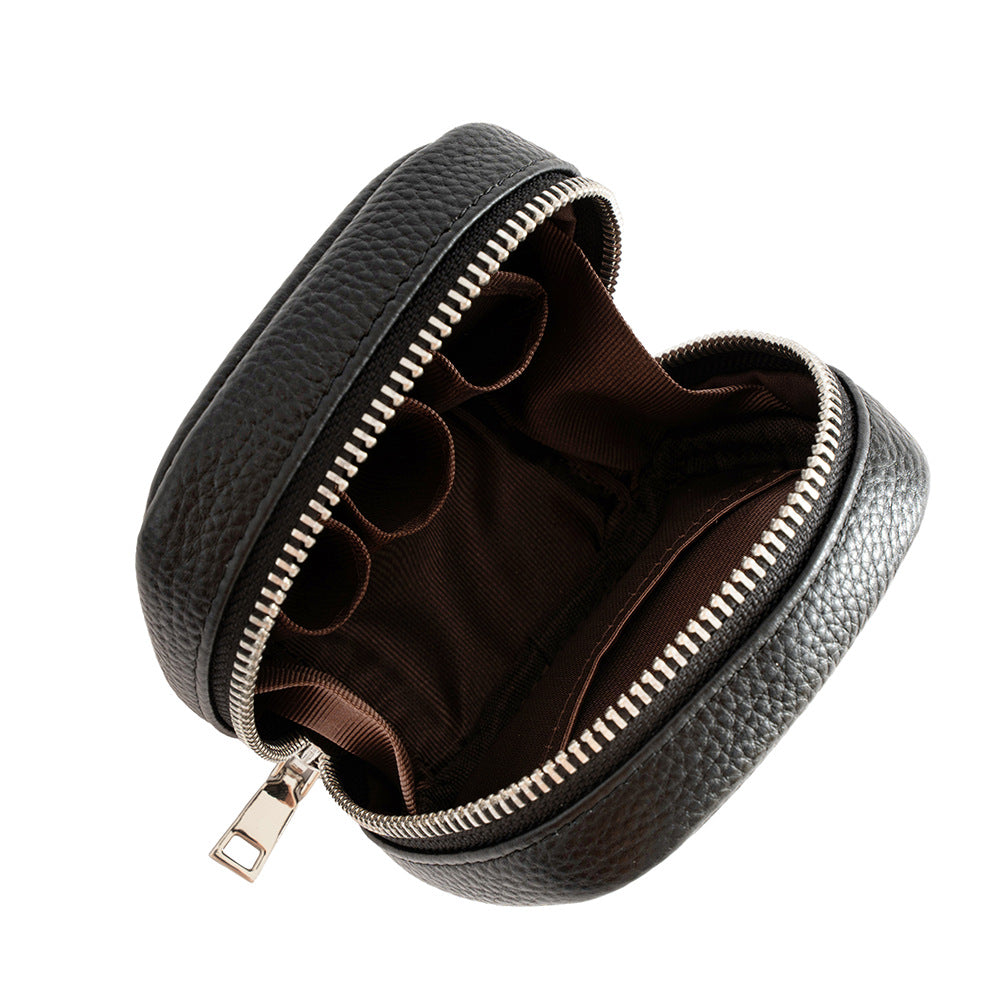 Open view of black cowhide leather mini cosmetic pouch showing interior compartments and polyester lining