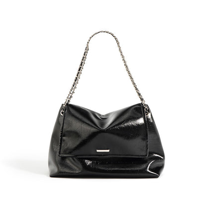 Black cowhide leather soft chain shoulder bag with chain strap on white background
