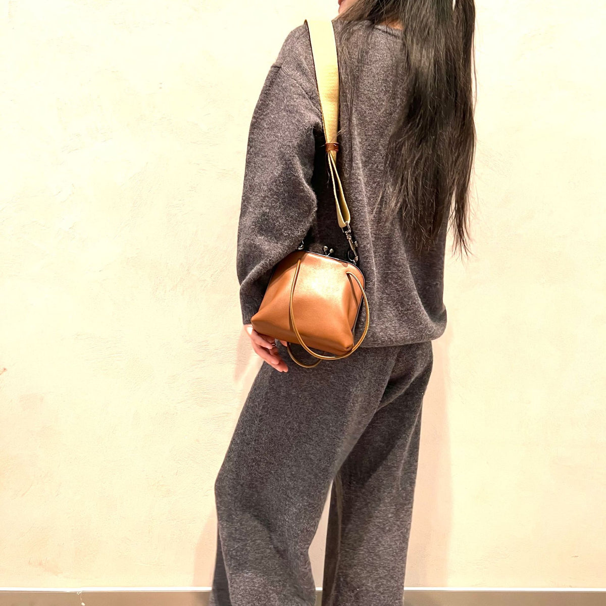 Coffee bag shown worn at the shoulder with optional wide strap