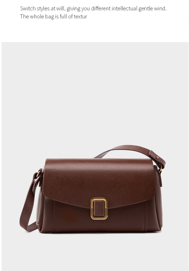 Dark brown cowhide leather crossbody bag with gold-tone buckle on light background