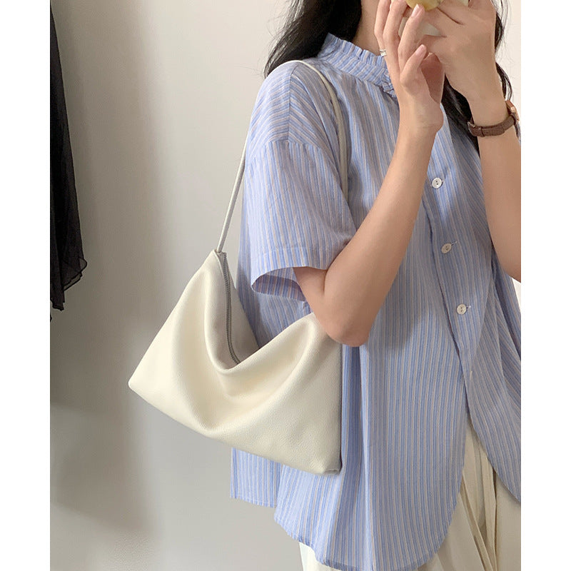 Cream soft hobo bag shown over the shoulder