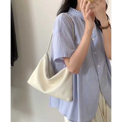 Cream soft hobo bag shown over the shoulder
