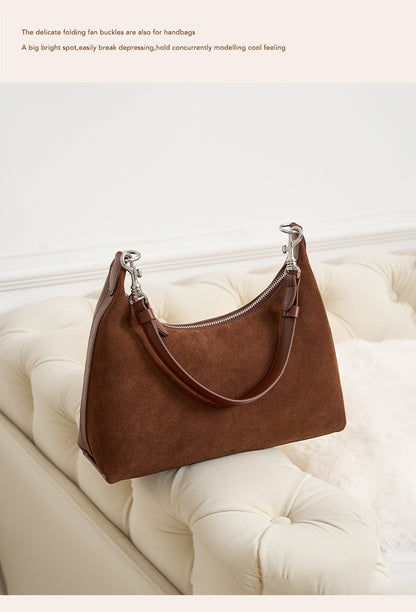 Rear view of the brown bag with its strap attached