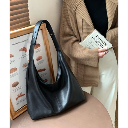 Black lambskin hobo tote with shoulder strap and zip opening