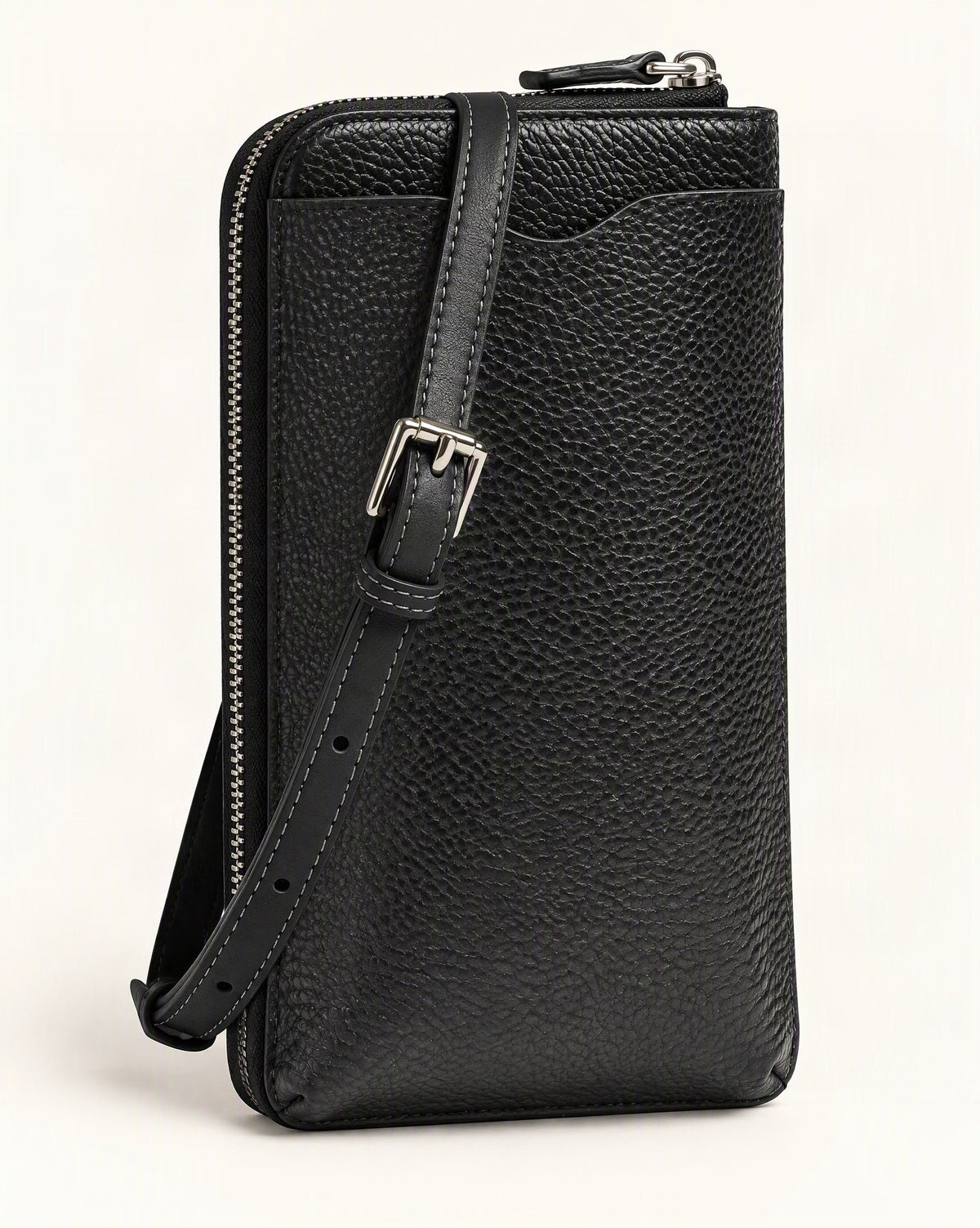 Cowhide Leather Vertical Phone Crossbody Bag — front three-quarter view on a warm white background