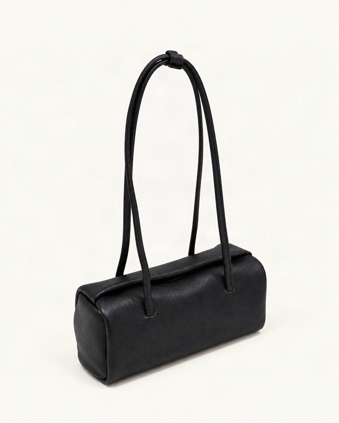 Top-Grain Cowhide Pillow Shoulder Bag — front three-quarter view on a warm white background
