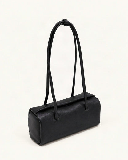 Top-Grain Cowhide Pillow Shoulder Bag — front three-quarter view on a warm white background