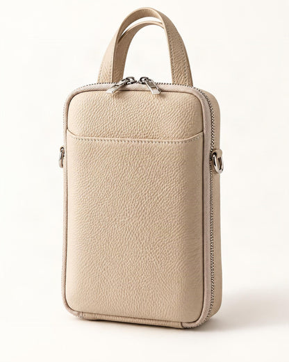 Cowhide Leather Vertical Phone Crossbody Bag – Color Options — front three-quarter view on a warm white background
