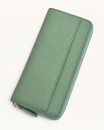 Leather Long Zip Clutch RFID Wallet — front three-quarter view on a warm white background