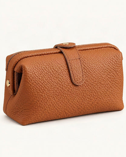 Top-Grain Cowhide Cosmetic Pouch – Color Options — front three-quarter view on a warm white background
