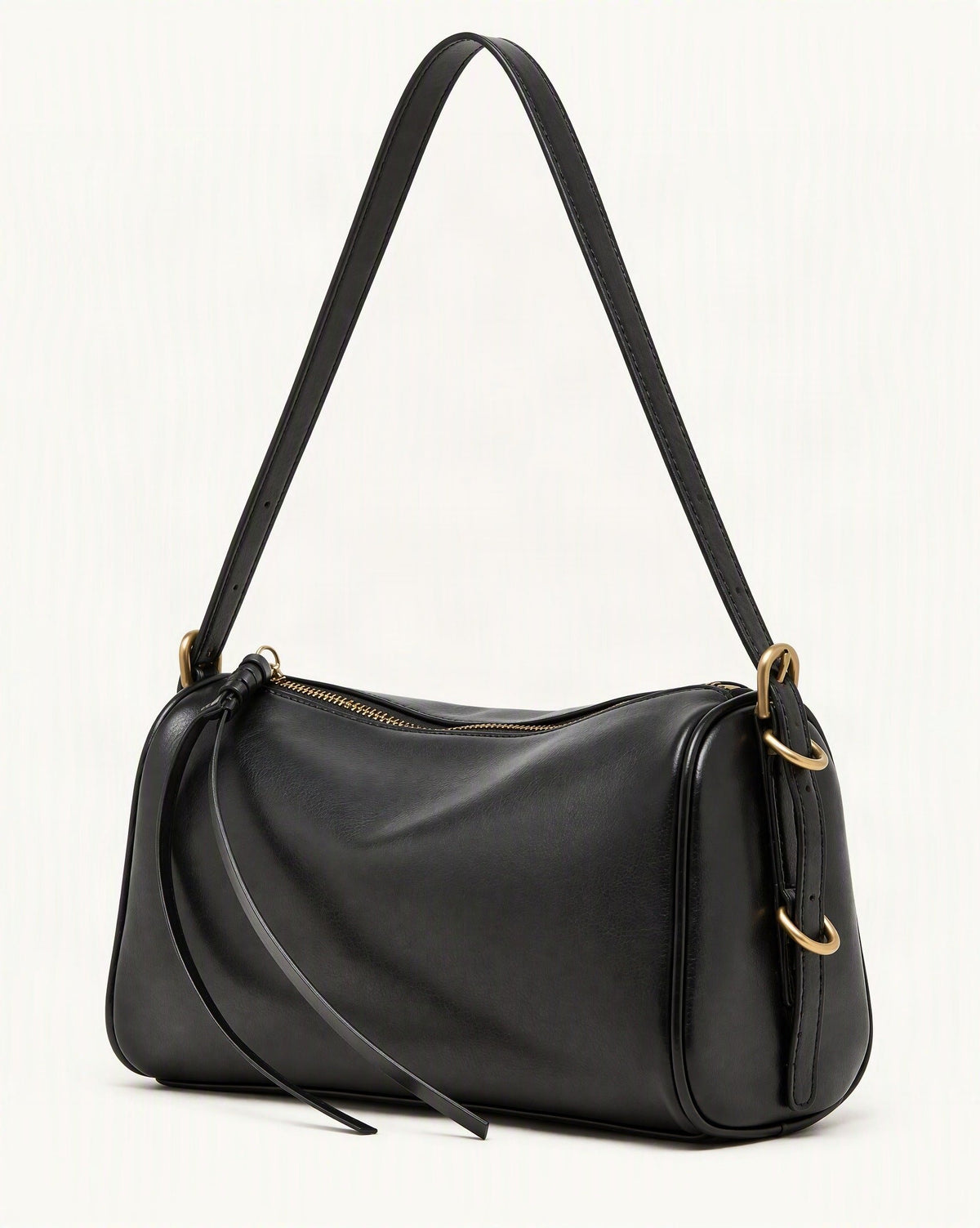 Cowhide Leather Small Crossbody Bag with Adjustable Strap — front three-quarter view on a warm white background