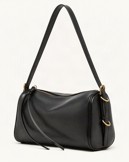 Cowhide Leather Small Crossbody Bag with Adjustable Strap — front three-quarter view on a warm white background
