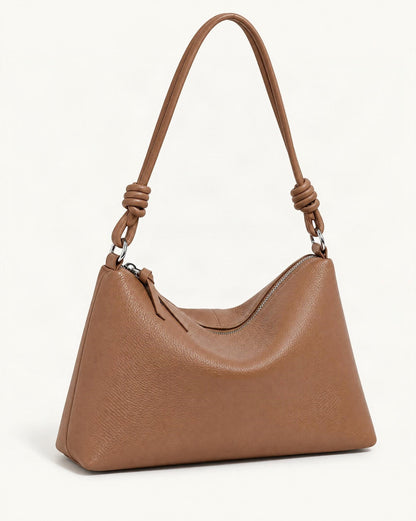 Pebbled Cowhide Leather Tote Shoulder Bag — front three-quarter view on a warm white background