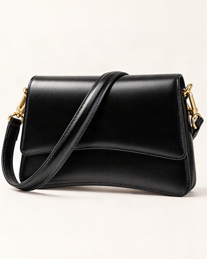 Cowhide Leather Small Shoulder Bag with Flap Closure — front three-quarter view on a warm white background