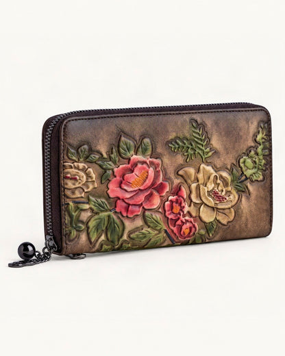 Cowhide Zip-Around Wallet Floral — front three-quarter view on a warm white background