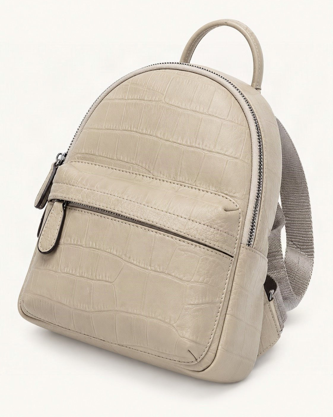Top-Grain Cowhide Small Backpack — front three-quarter view on a warm white background