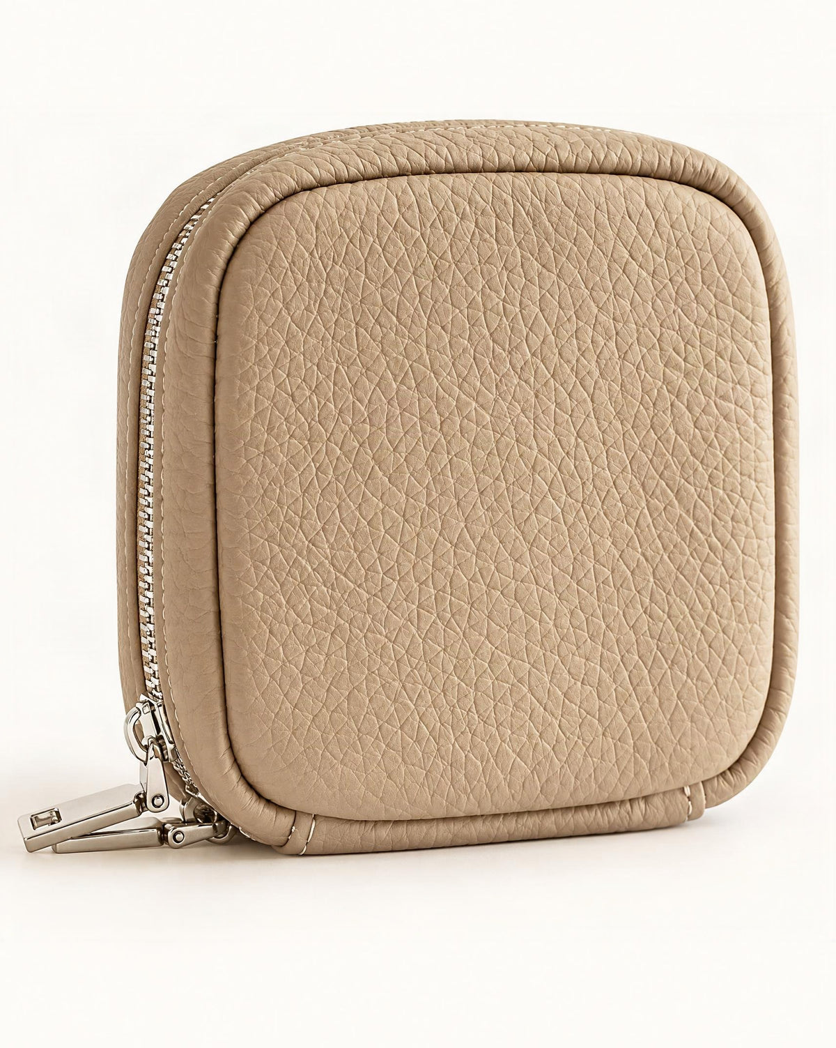 Pebbled Leather Mini Cosmetic Pouch — front three-quarter view on a warm white background