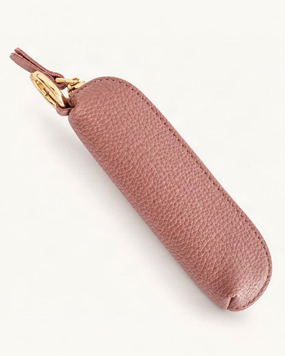 Top-Grain Cowhide Mini Zip Coin Purse with Key Clip — front three-quarter view on a warm white background