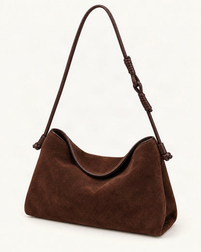 Suede Cowhide Shoulder Crossbody Bag — front three-quarter view on a warm white background