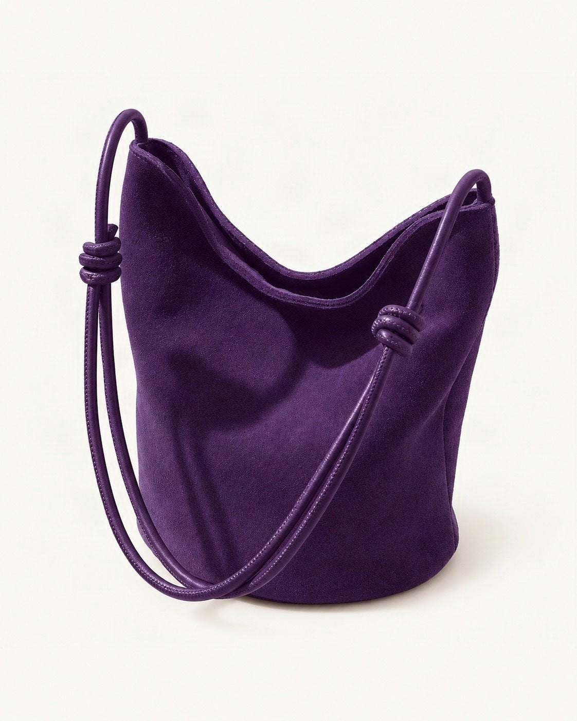 Nubuck Cowhide Mini Bucket Shoulder Bag — front three-quarter view on a warm white background