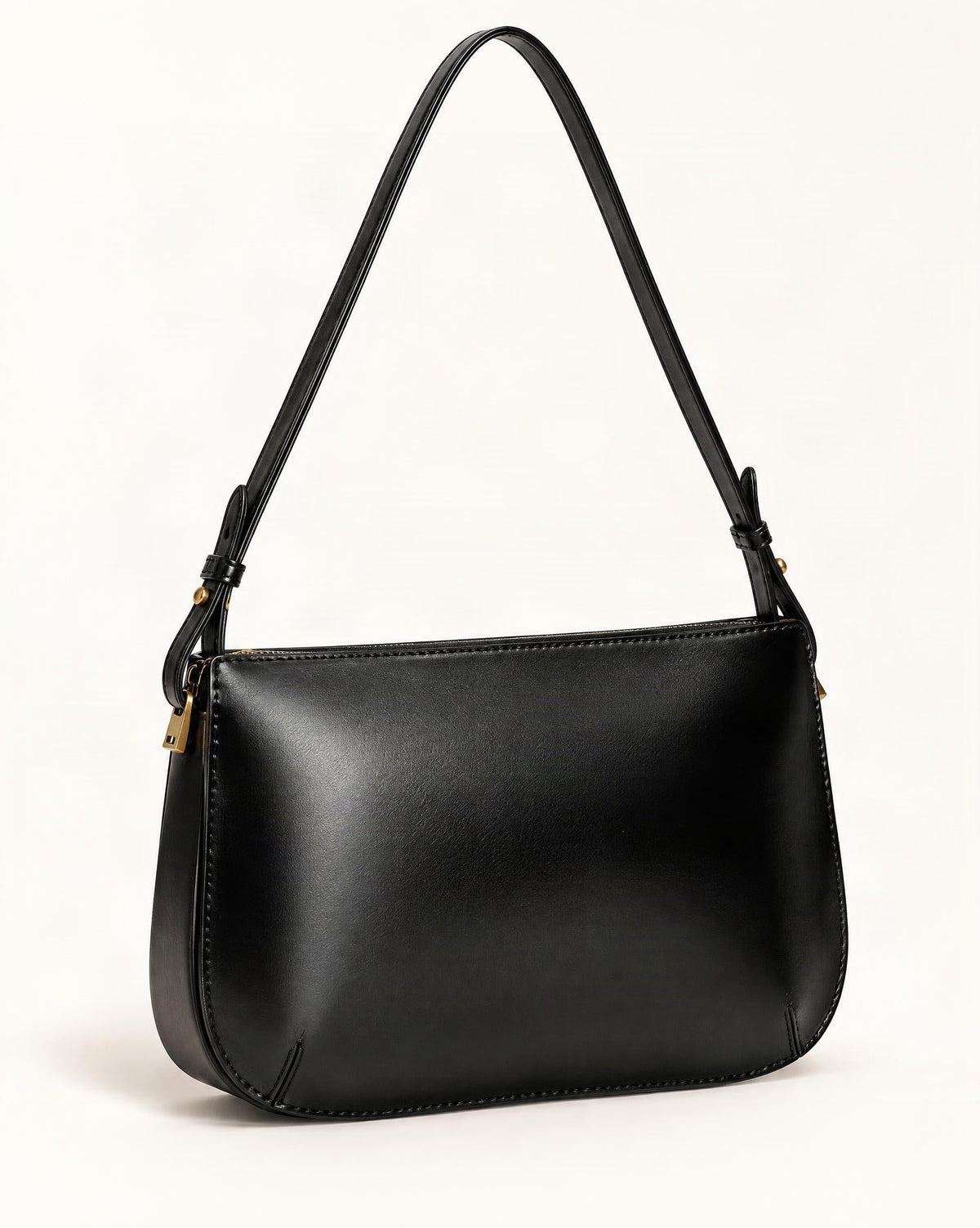 Cowhide Leather Underarm Bag with Detachable Strap — front three-quarter view on a warm white background