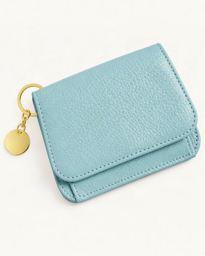Genuine Leather RFID-Blocking Mini Wallet with Keyring Charm — front three-quarter view on a warm white background