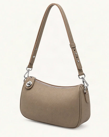 Pebbled Cowhide Leather Crossbody Bag — front three-quarter view on a warm white background