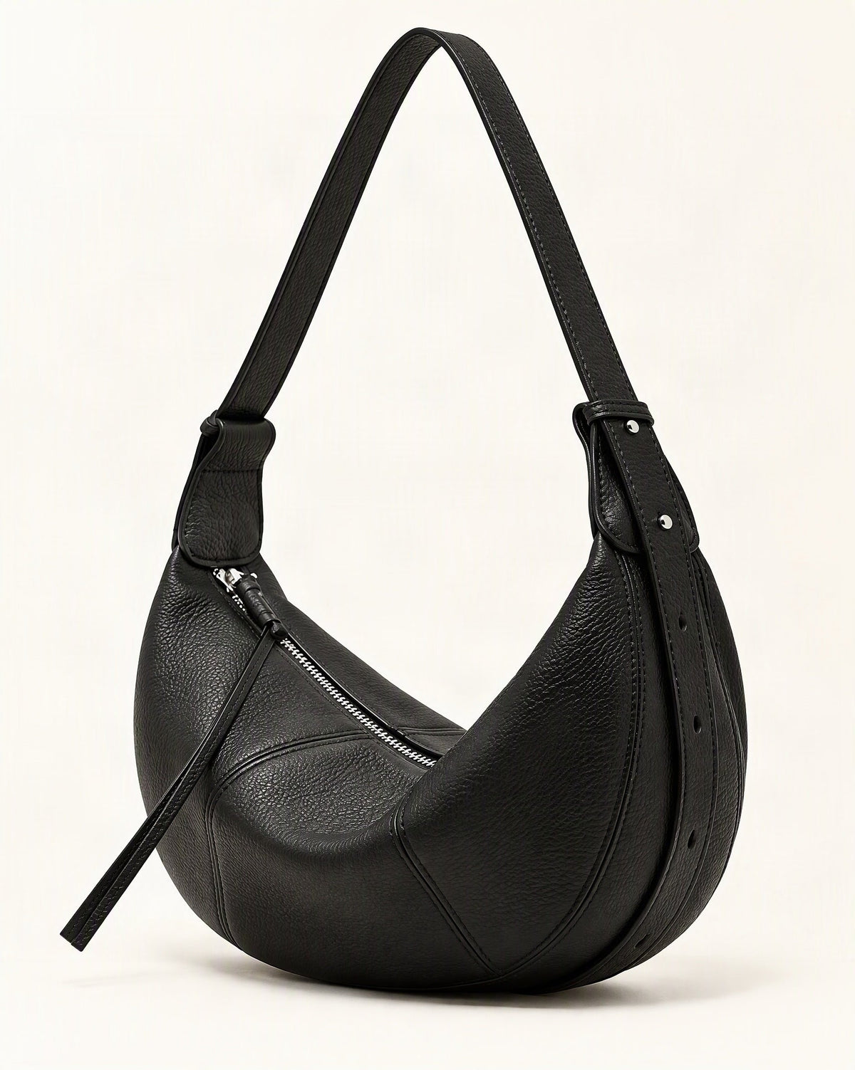 Cowhide Leather Crescent Hobo Crossbody Bag — front three-quarter view on a warm white background