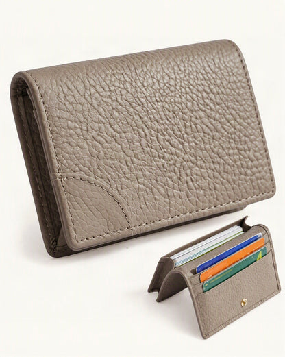 Cowhide Leather Mini Bifold Card Holder Wallet — front three-quarter view on a warm white background