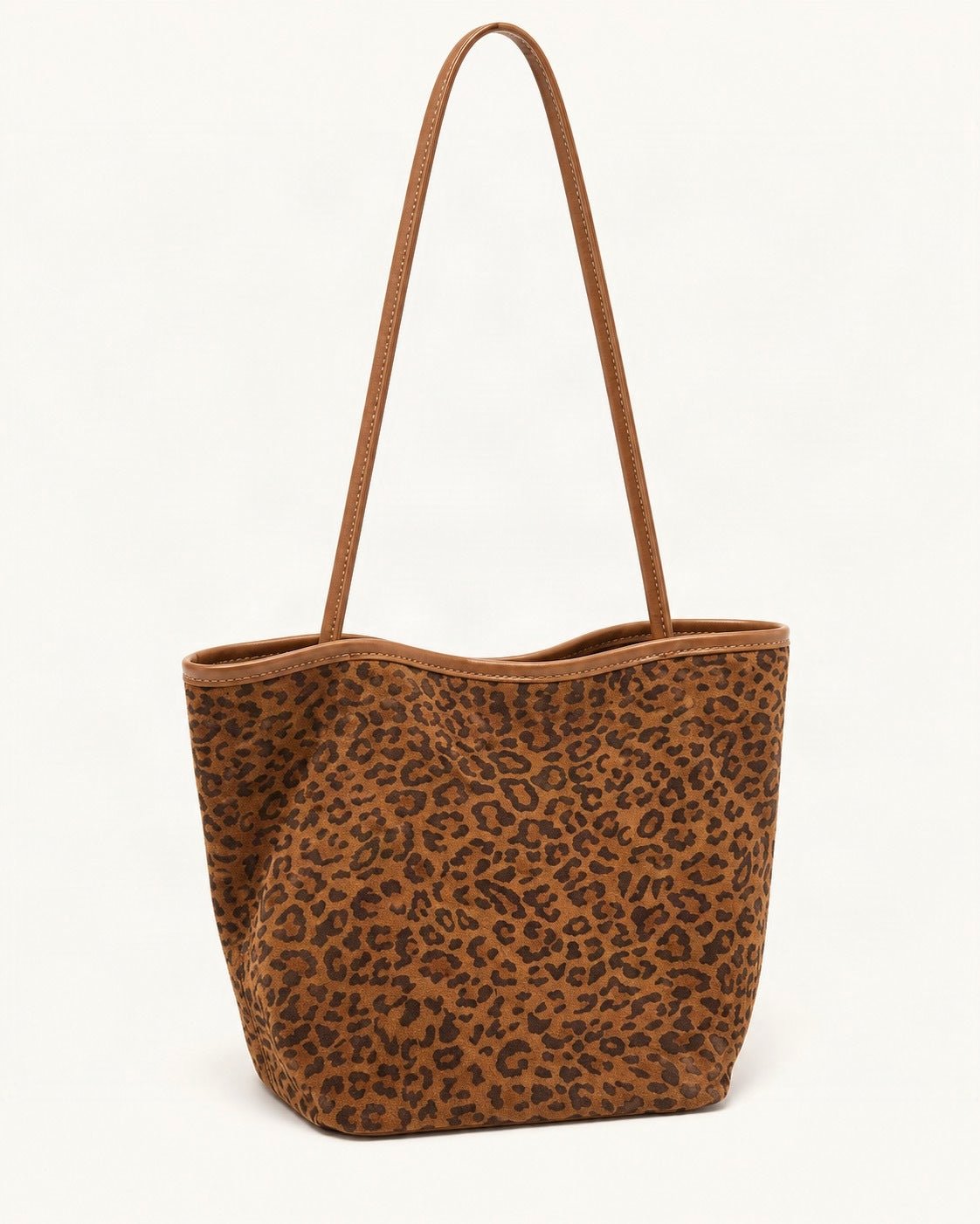 Suede Bucket Tote Bag — front three-quarter view on a warm white background