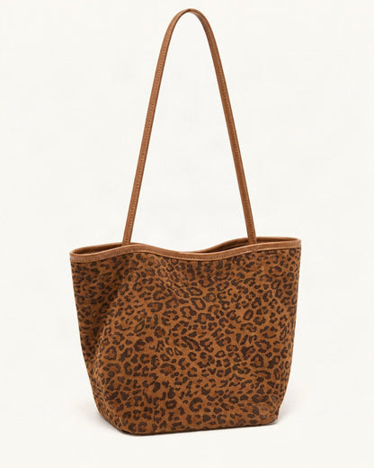 Suede Bucket Tote Bag — front three-quarter view on a warm white background
