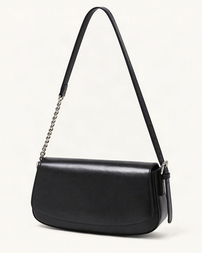 Cowhide Leather Baguette Saddle Shoulder Bag — front three-quarter view on a warm white background