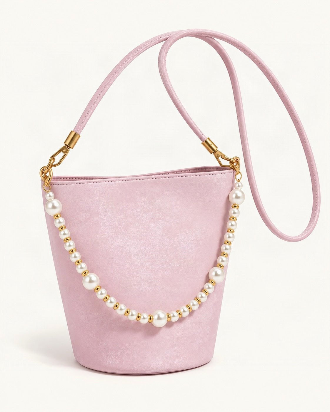Split Leather Mini Bucket Bag with Pearl Chain — front three-quarter view on a warm white background