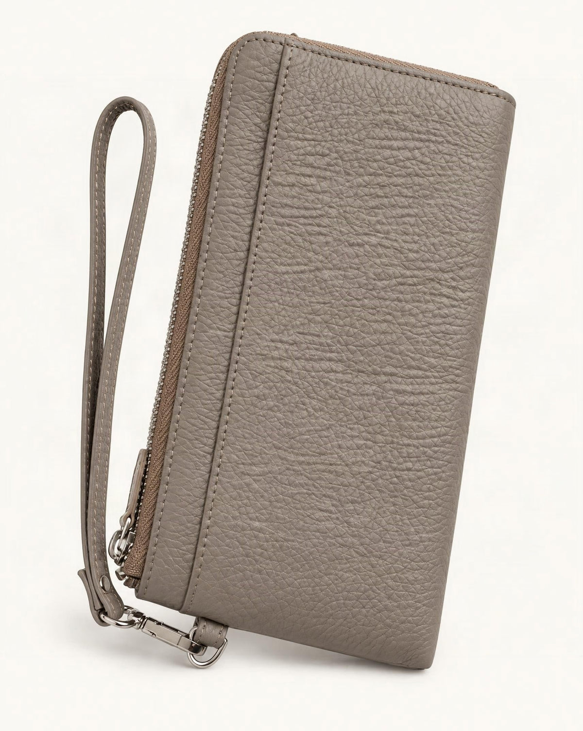 RFID-Blocking Pebbled Cowhide Long Zip Clutch — front three-quarter view on a warm white background