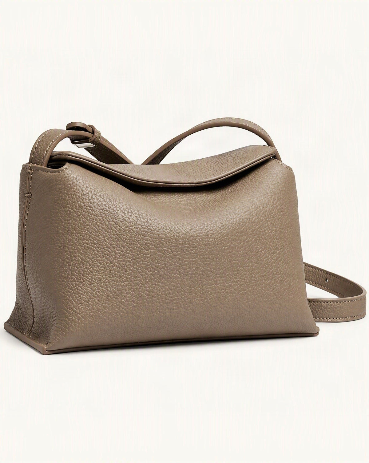 Cowhide Leather Mini Crossbody Bag – Color Options — front three-quarter view on a warm white background