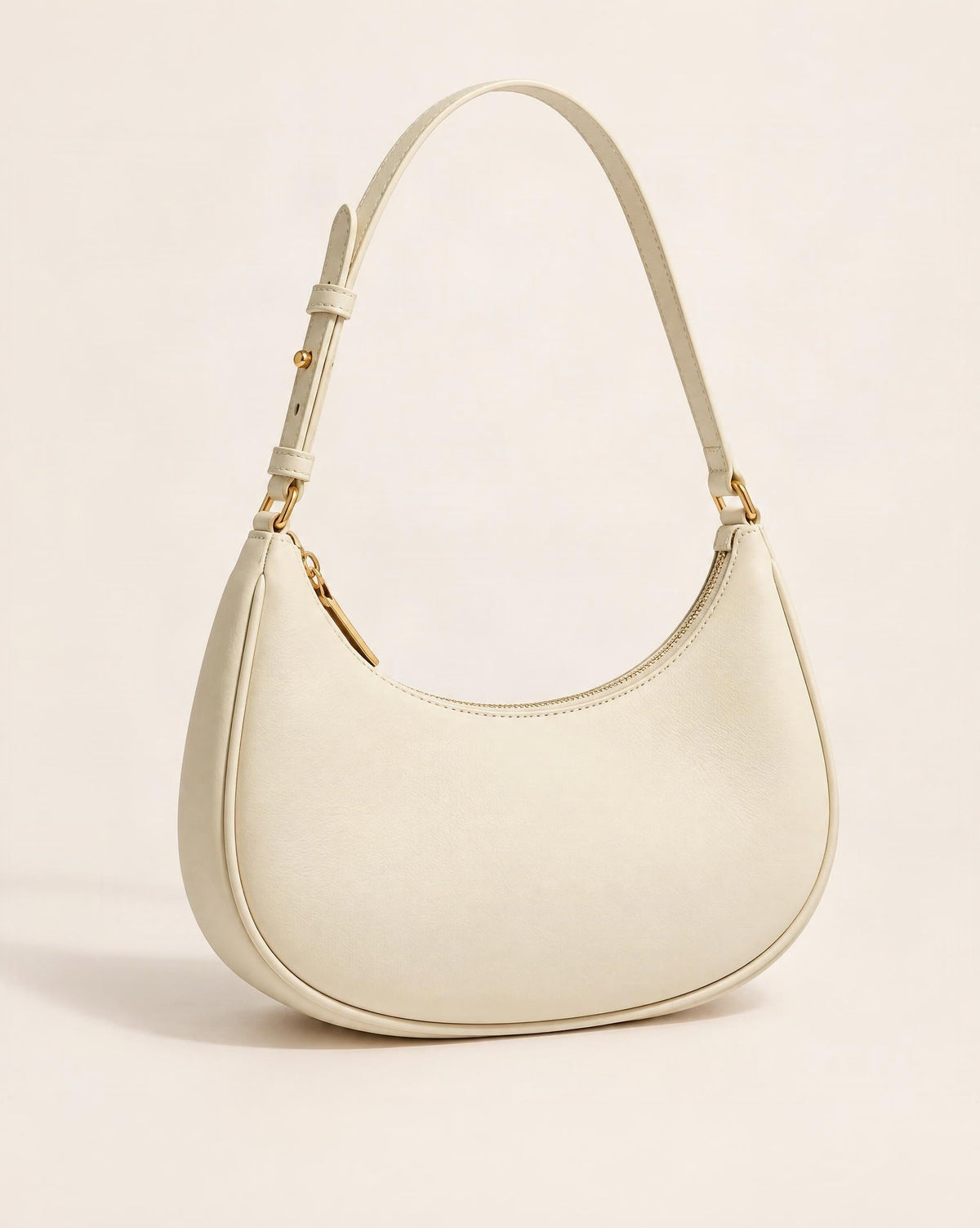 Cowhide Leather Crescent Hobo Shoulder Bag — front three-quarter view on a warm white background