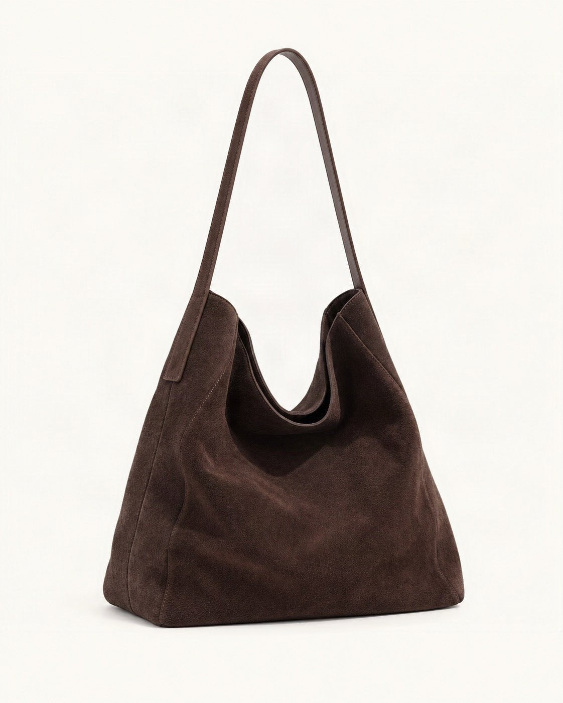 Suede Cowhide Slouchy Shoulder Tote Bag — front three-quarter view on a warm white background