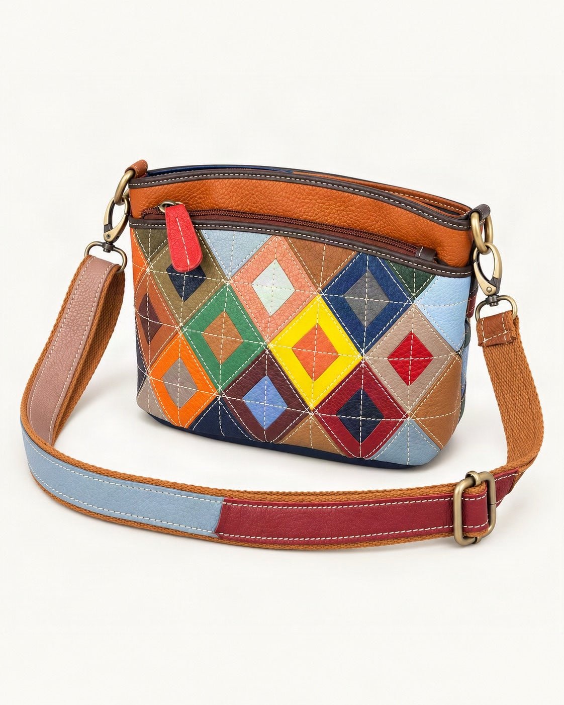 Top-Grain Cowhide Small Crossbody Bag — front three-quarter view on a warm white background