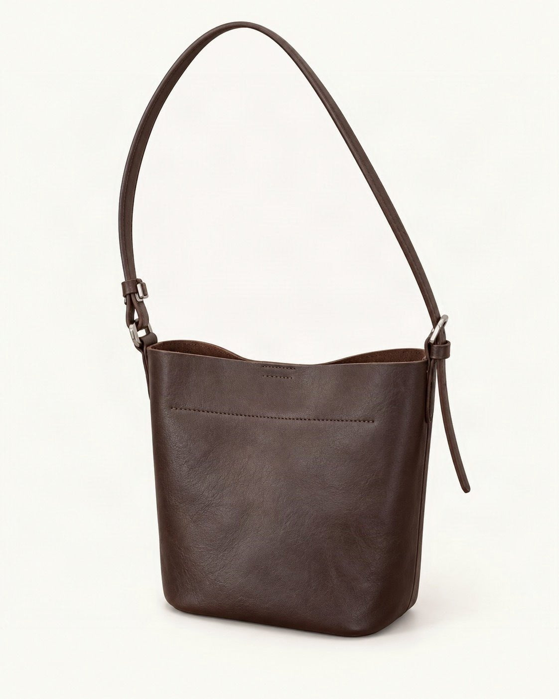 Top-Grain Cowhide Mini Bucket Shoulder Bag — front three-quarter view on a warm white background