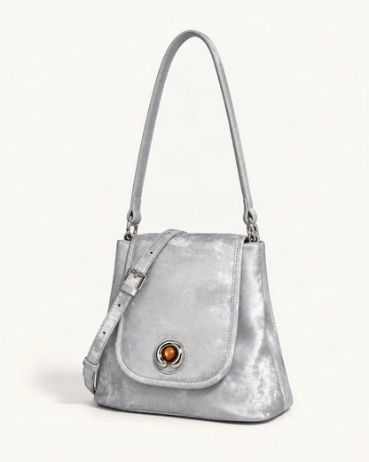 Split Leather Small Bucket Bag with Magnetic Flap — front three-quarter view on a warm white background