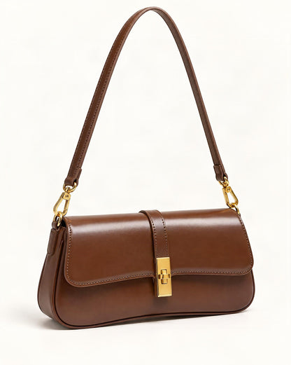 Cowhide Leather Small Shoulder Bag with Turn-Lock Closure — front three-quarter view on a warm white background