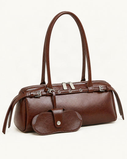Cowhide Leather Small Barrel Tote with Sunglass Pouch — front three-quarter view on a warm white background