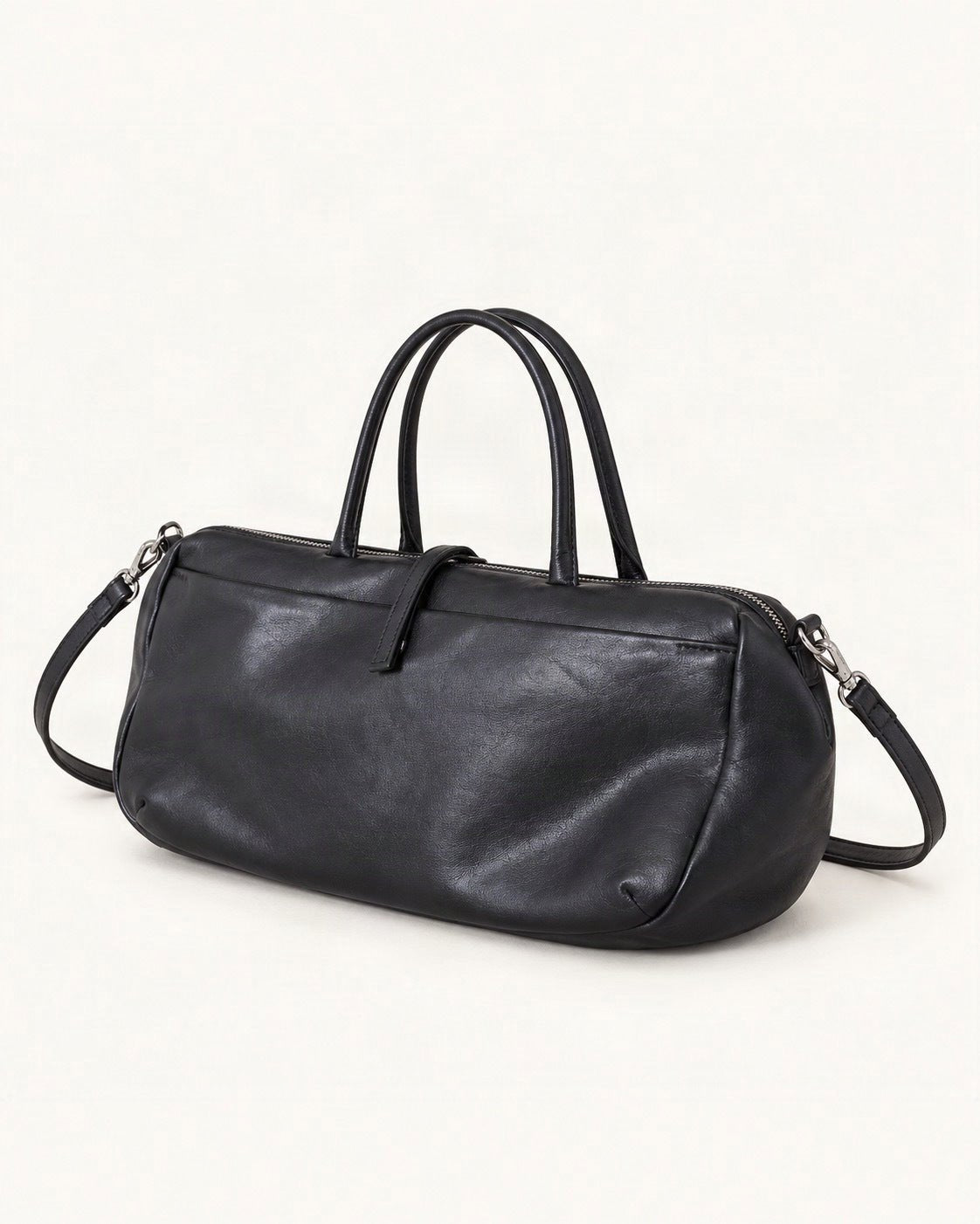 Lambskin Small Boston Bag — front three-quarter view on a warm white background