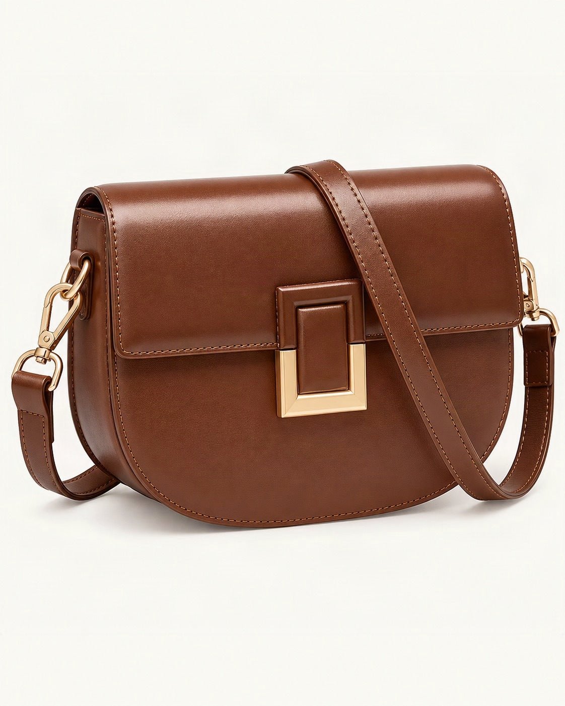 Cowhide Mini Saddle Crossbody Bag — front three-quarter view on a warm white background